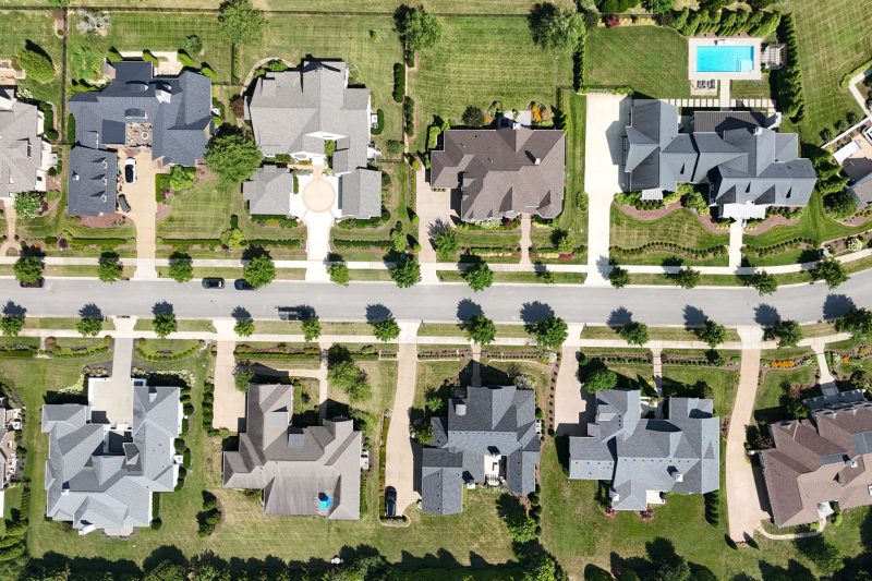 Overhead view of modern homes surrounded by lush greenery in a Tennessee suburb.