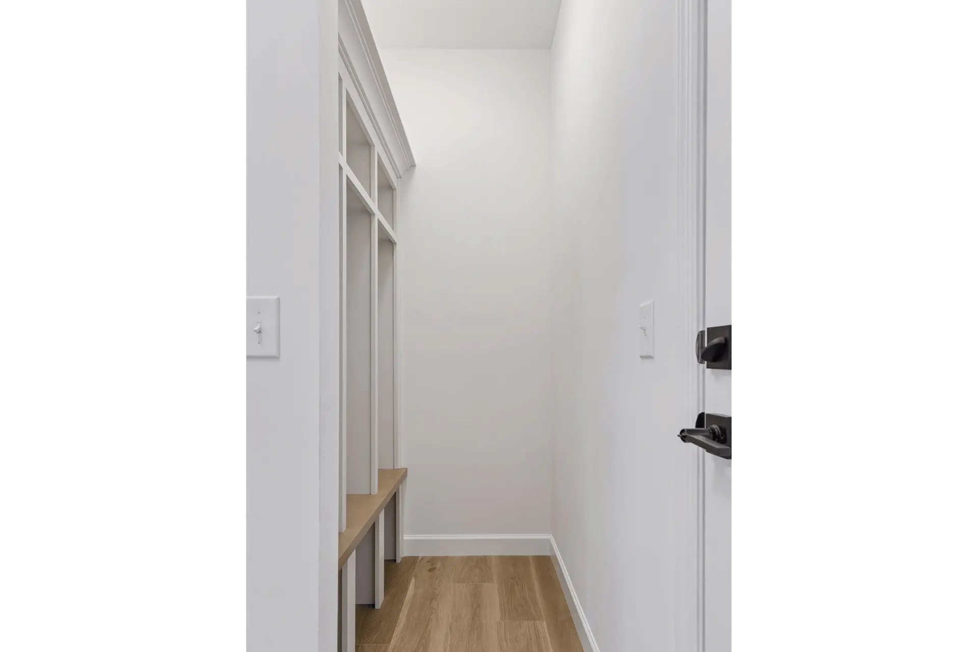 Drop-off zone near garage entry to hang coats, backpacks and shoes or boots
